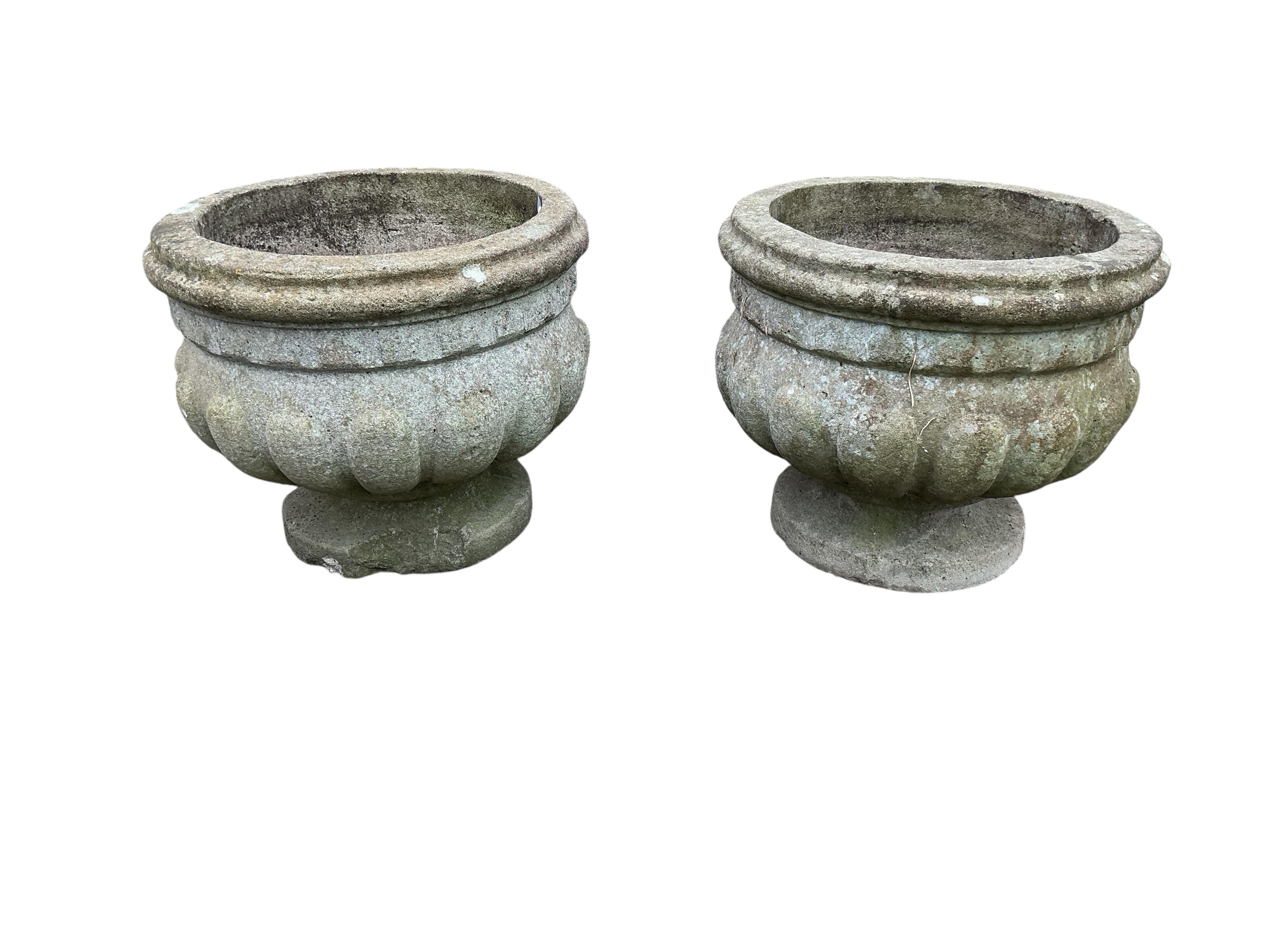 A pair of circular reconstituted stone garden planters, diameter 50cm, height 41cm